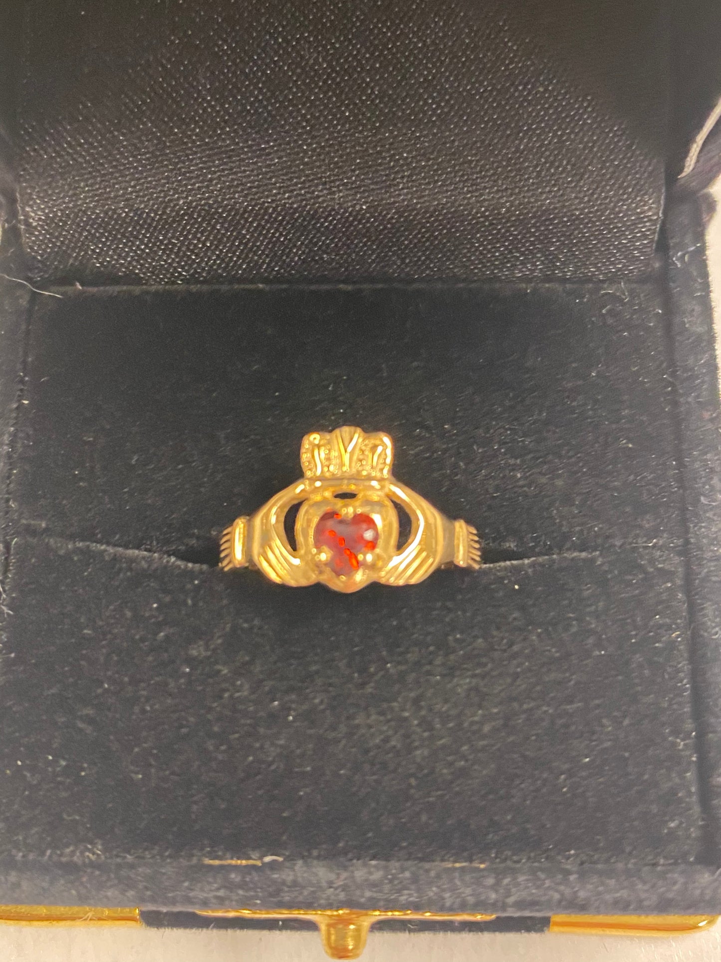 Gold Claddagh Ring with Garnet Stone