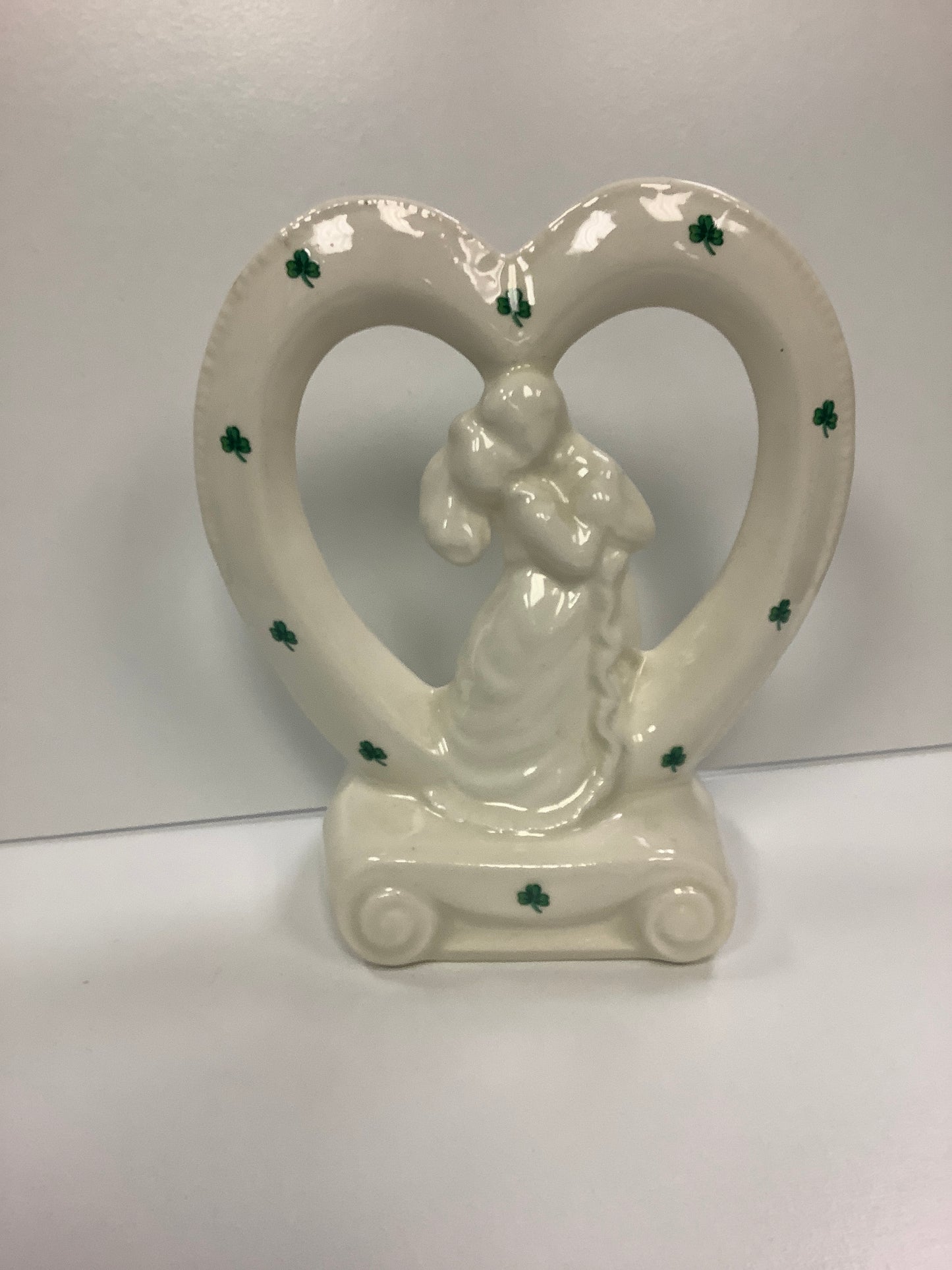 Porcelain bride and groom in heart with shamrocks