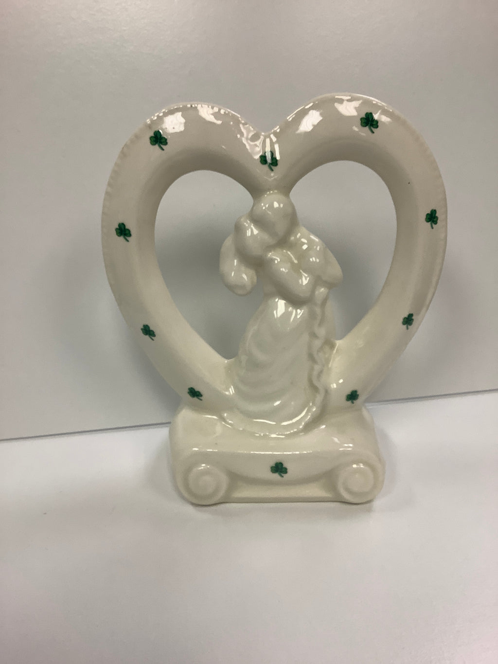 Porcelain bride and groom in heart with shamrocks