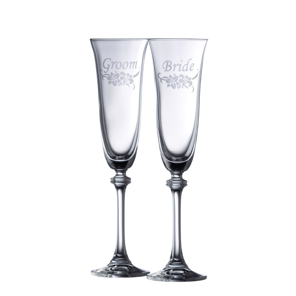 Bride and groom toasting flutes