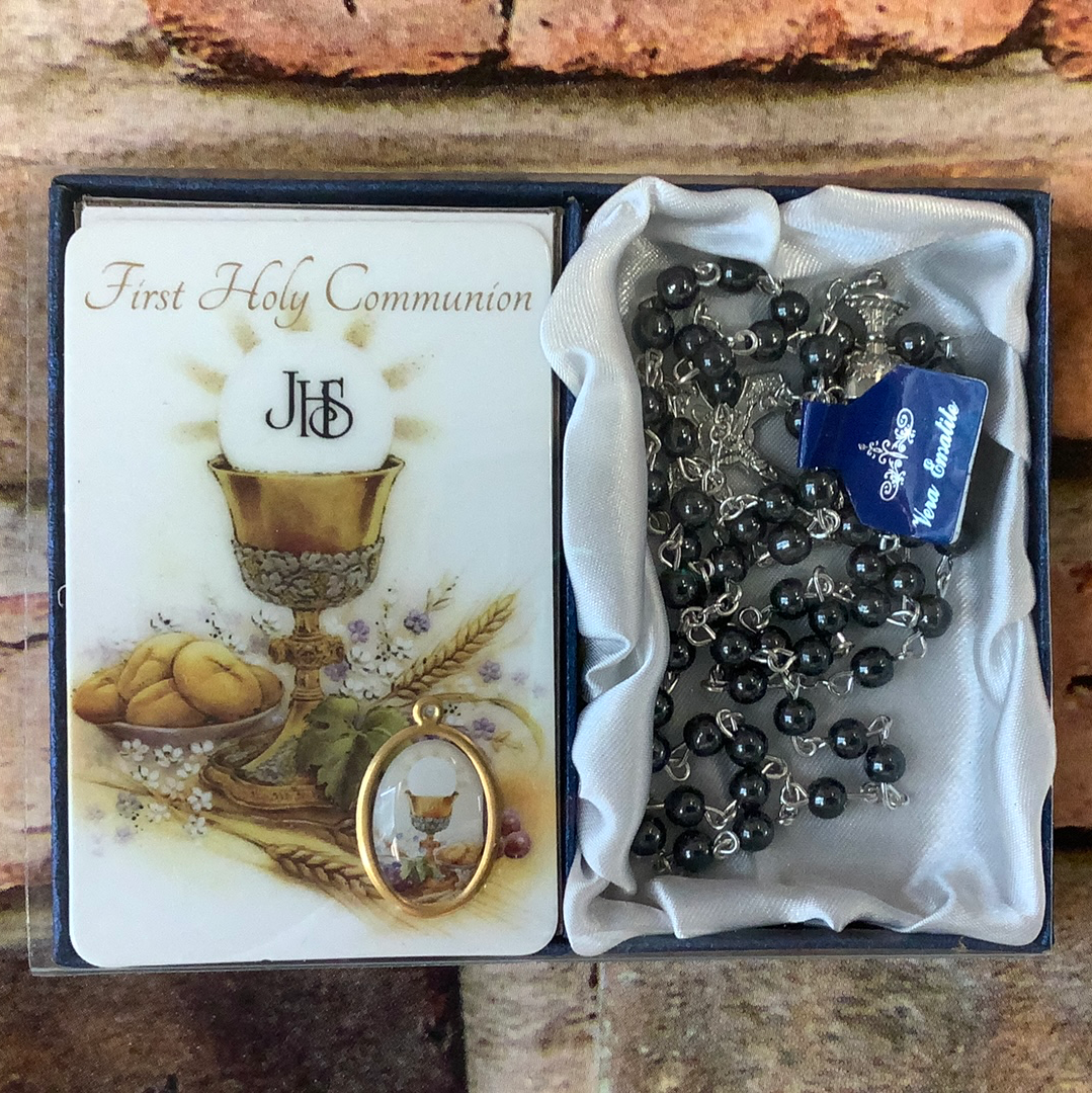 First communion rosary with prayer card